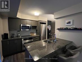 Toronto (Clanton Park) condo for rent - A kitchen with a granite countertop and stainless steel appliances.