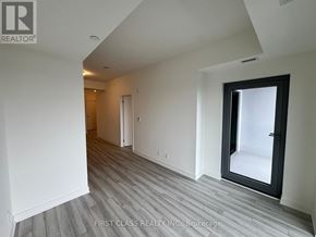 Clarington (Bowmanville) condo for rent - A room with a grey floor and white walls.