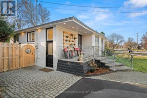 Aurora (Aurora Highlands) apartment for rent - A house with a grey exterior and a black door is shown.
