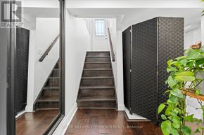 Aurora (Aurora Highlands) apartment for rent - A staircase with a glass railing and wooden steps.
