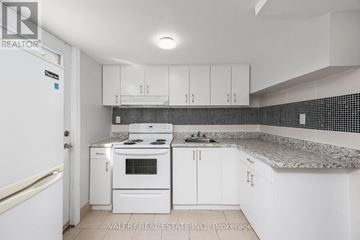Cambridge apartment for rent - A kitchen with white appliances and cabinets.