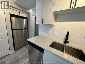 Chatham apartment for rent - A kitchen with a stainless steel refrigerator and a sink.