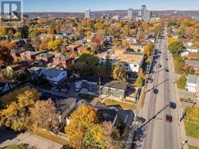 Ottawa multi-family for rent - A street view of a residential area with houses and trees.