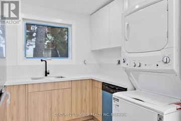 Ottawa multi-family for rent - A kitchen with a white oven and wooden cabinets.