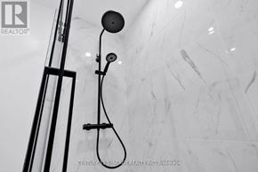 Ottawa multi-family for rent - A shower head mounted on a wall.