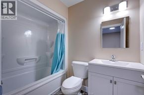 Windsor apartment for rent - A bathroom with a toilet, sink, and shower.