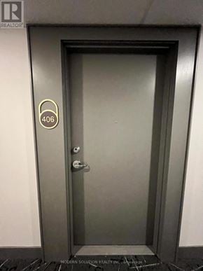 Kitchener condo for rent - A door with a number 406 on it.