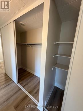 Niagara Falls (Downtown) apartment for rent - A small, empty room with a door open to a hallway.