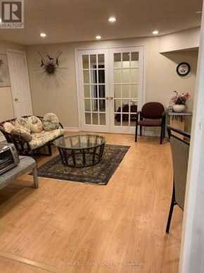 Markham (Unionville) apartment for rent - A living room with a couch, chair, and coffee table.