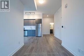 Barrie (Little Lake) condo for rent - A spacious kitchen with a dining area is visible through the open door.