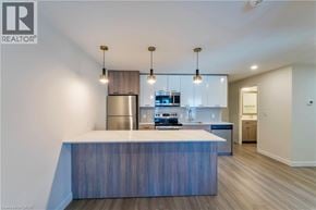 Hamilton townhouse for rent - A modern kitchen with a large island in the middle.