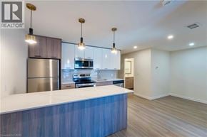 Hamilton townhouse for rent - A modern kitchen with a blue countertop and stainless steel appliances.