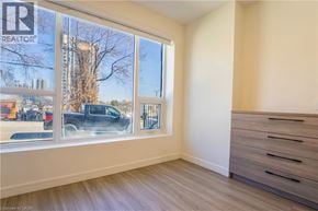 Hamilton townhouse for rent - A room with a window showing a street view and a sign that says REALTOR.