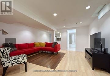 Vaughan (Lakeview Estates) apartment for rent - A living room with a red couch and a television.