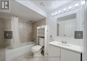 Vaughan (Lakeview Estates) apartment for rent - A white bathroom with a tub, toilet, and sink.