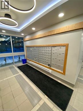 Waterloo condo for rent - A realtor's office with a large board of contact information.