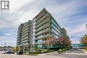 Richmond apartment for rent - A modern apartment building with a parking lot in front.