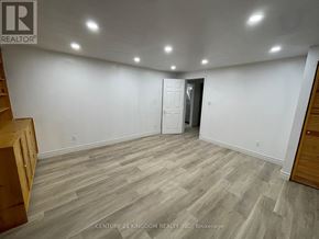 Pickering (Liverpool) apartment for rent - A room with wooden flooring and white walls, with a door in the background.