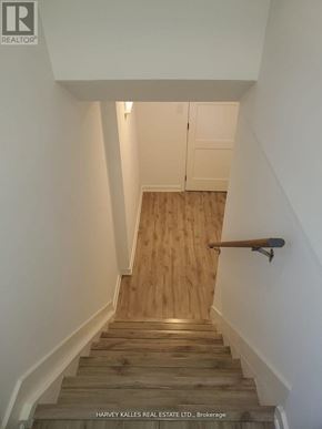 Newmarket (Central Newmarket) apartment for rent - A staircase with wooden steps and a handrail.