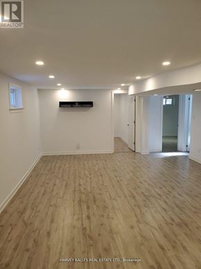 Newmarket (Central Newmarket) apartment for rent - A room with wooden flooring and white walls, with a window on the left wall.