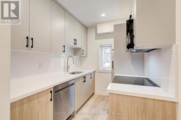 Toronto (Annex) apartment for rent - A modern kitchen with wooden cabinets and stainless steel appliances.
