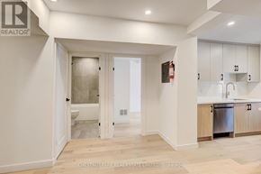 Toronto (Annex) apartment for rent - A modern kitchen with white cabinets and a wooden floor.