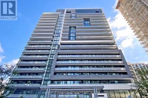Richmond Hill (Langstaff) condo for rent - A tall residential building with a clear sky in the background.