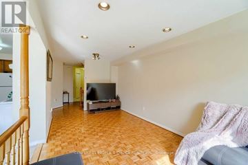 Mississauga (Central Erin Mills) townhouse for rent - A living room with a television and a couch.