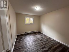 Peterborough (Town Ward 3) apartment for rent - A room with a window and wooden flooring.