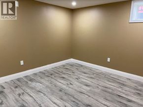 Kitchener apartment for rent - A room with a wooden floor and a window.