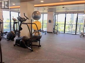 Toronto (Mimico) condo for rent - A gym with a variety of equipment including a stationary bike, a rowing machine, and a weight bench.