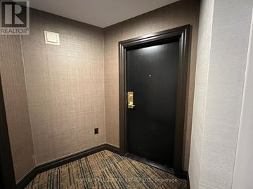 Toronto (Englemount-Lawrence) condo for rent - A dining room with a wooden table and chairs.