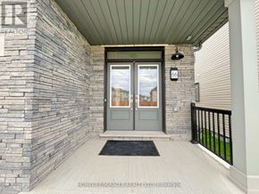 Welland (Dain City) apartment for rent - A front door with a glass window and a black mat in front of it.