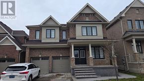 Haldimand apartment for rent - A white car is parked in front of a house with a brick facade.