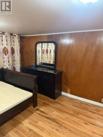 Mississauga (Sheridan) apartment for rent - A bedroom with a bed, nightstand, and a window with a curtain.
