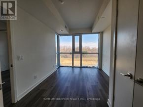 Toronto (Parkwoods-Donalda) condo for rent - A room with a view of a field through the windows.
