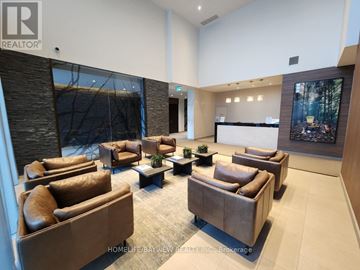 Toronto (Parkwoods-Donalda) condo for rent - A living room with brown leather couches and a painting on the wall.