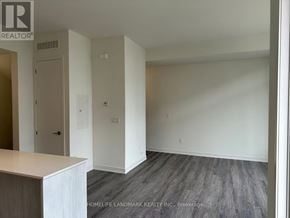 Richmond Hill townhouse for rent - A realtor photo of a room with a door and a wall socket.