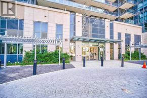 Toronto (Woburn) condo for rent - The image shows a building entrance with a glass door and a sign that reads "JDL REALTY INC Brokerage".