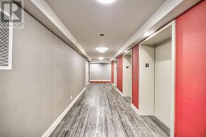 Toronto (Woburn) condo for rent - A long hallway with doors on the right and a logo in the top left.