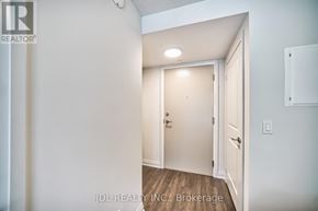 Toronto (Woburn) condo for rent - A white door in a room with a wooden floor.
