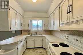 Niagara Falls (Arad/Fallsview) apartment for rent - A kitchen with white cabinets and appliances.
