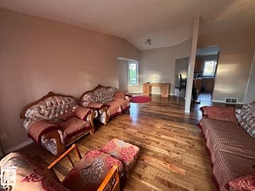 Edmonton apartment for rent - A living room with a couch and a chair.