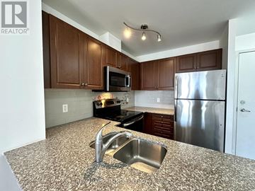 Markham (Old Markham Village) condo for rent - A kitchen with a granite counter top and stainless steel appliances.