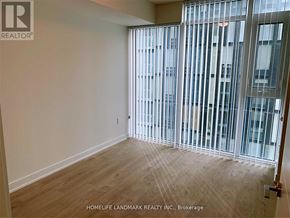 Toronto (Church-Yonge Corridor) condo for rent - A room with a sliding glass door leading to a balcony.