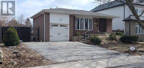 Oakville (Wo West) apartment for rent - A house with a garage and a driveway in front of it.