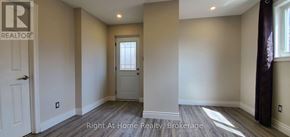 Oakville (Wo West) apartment for rent - A hallway with a door and a window.