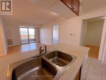 Mississauga (City Centre) condo for rent - A kitchen with a sink and a window.