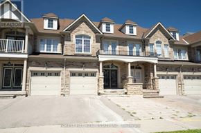 Vaughan (Patterson) apartment for rent - A large, multi-level house with a balcony and multiple garages.
