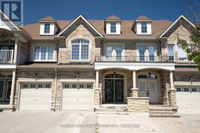 Vaughan (Patterson) apartment for rent - A large house with a balcony and a garage.